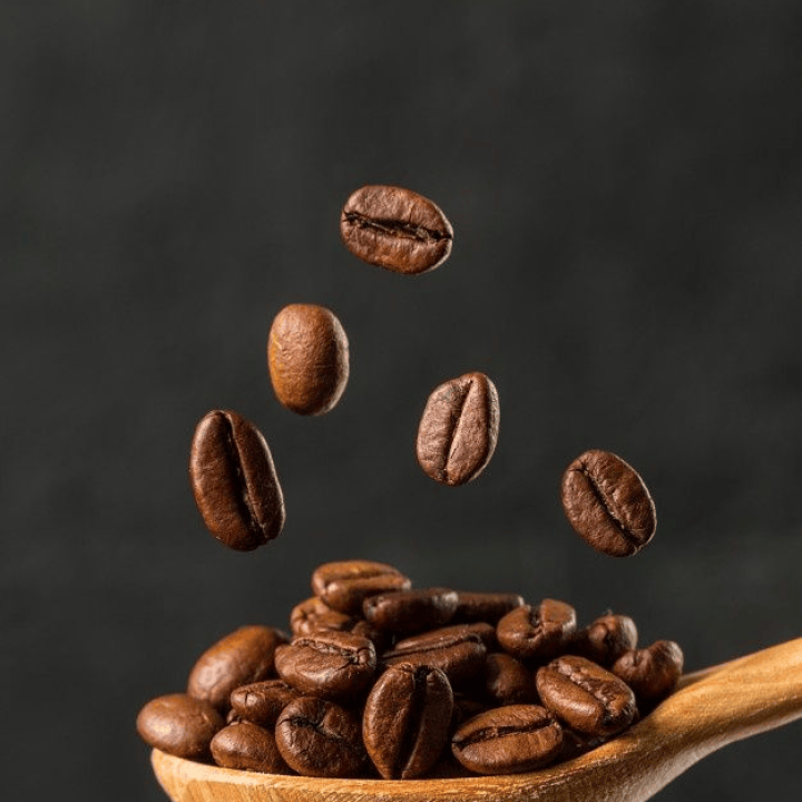 Premium Photo _ Macro falling coffee bean on gray background